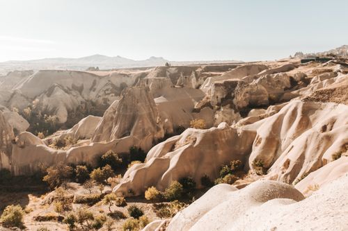 Free Explore the breathtaking aerial view of Cappadocia's distinctive formations under clear skies. Stock Photo