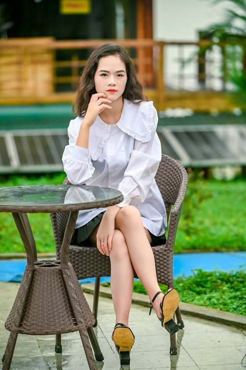 Woman Wearing a White Blouse Posing Outdoors