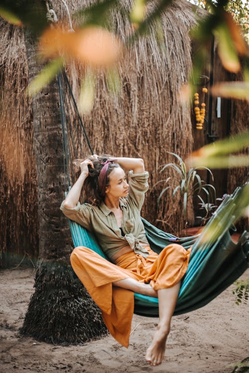 Free A Beautiful Woman Lying on a Hammock Stock Photo