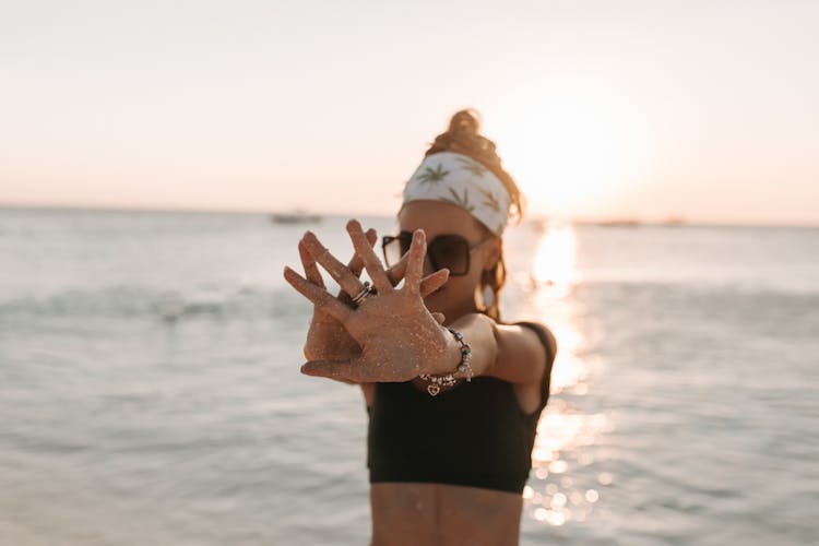 Woman Wearing Black Tank Top On The Beach During Sunset