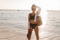 Woman in Black Bikini Standing on Beach