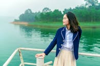 A Girl Leaning on a Hand Rail