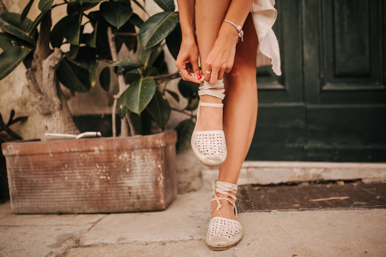 A Person Putting On Shoes