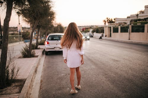 A Woman Walking on the Road