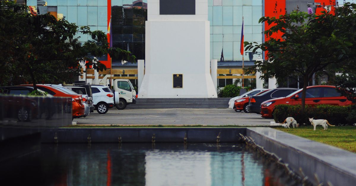 Campus of Batangas state university with tower near water · Free Stock ...