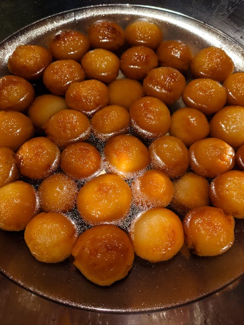 Close-Up Shot of Gulab Jamun in Stainless Bowl
