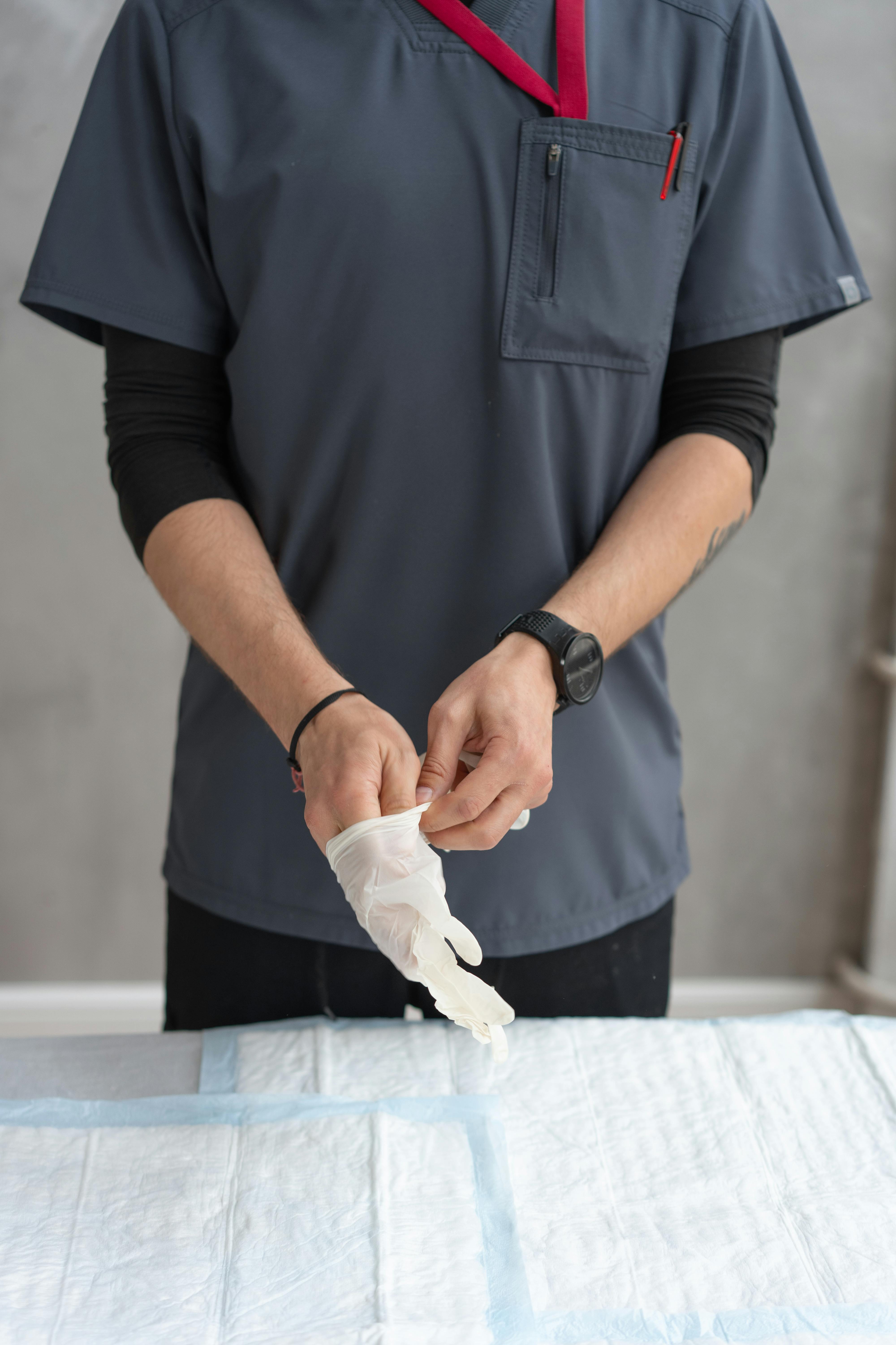 unrecognizable man wearing a latex glove