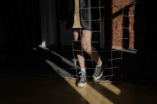 Person Standing behind a Net