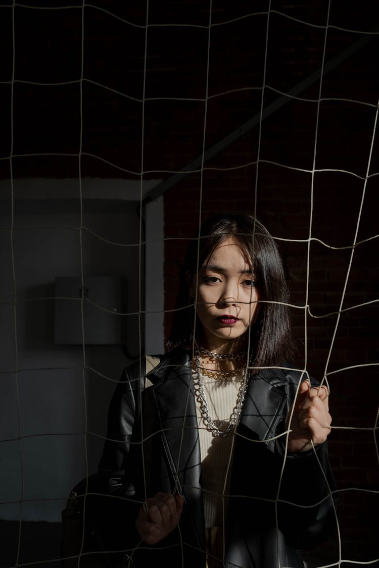 Woman Behind A Net