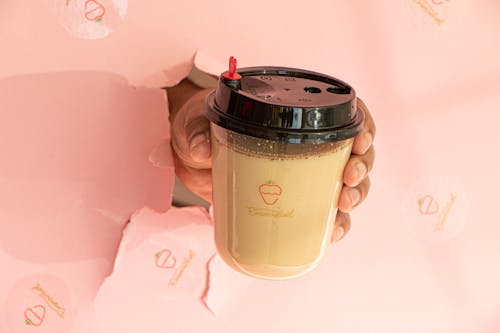 Free Close up of a Person Holding a Coffee Cup Stock Photo