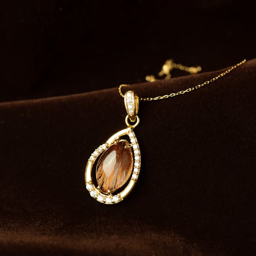 Free Gold Necklace with Precious Stone and Diamonds Stock Photo