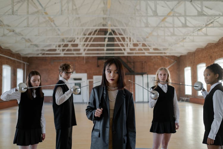 Group Of Students Holding Fencing Blades