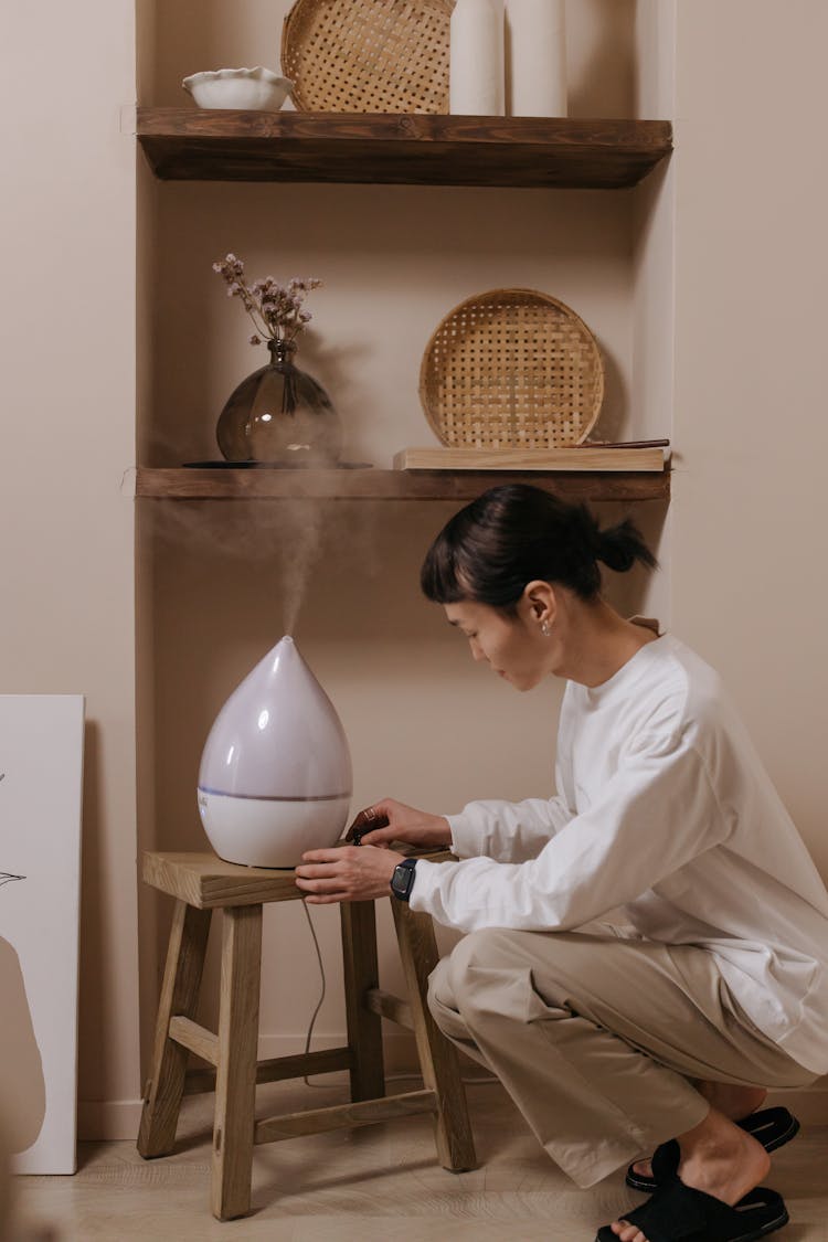 A Man Using A Humidifier