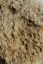Textured background of limestone with rugged surface