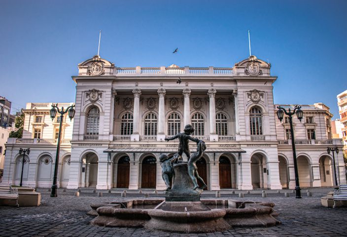 Elegant view of the historic Municipal Theatre in Santiago, Chile with a central fountain.