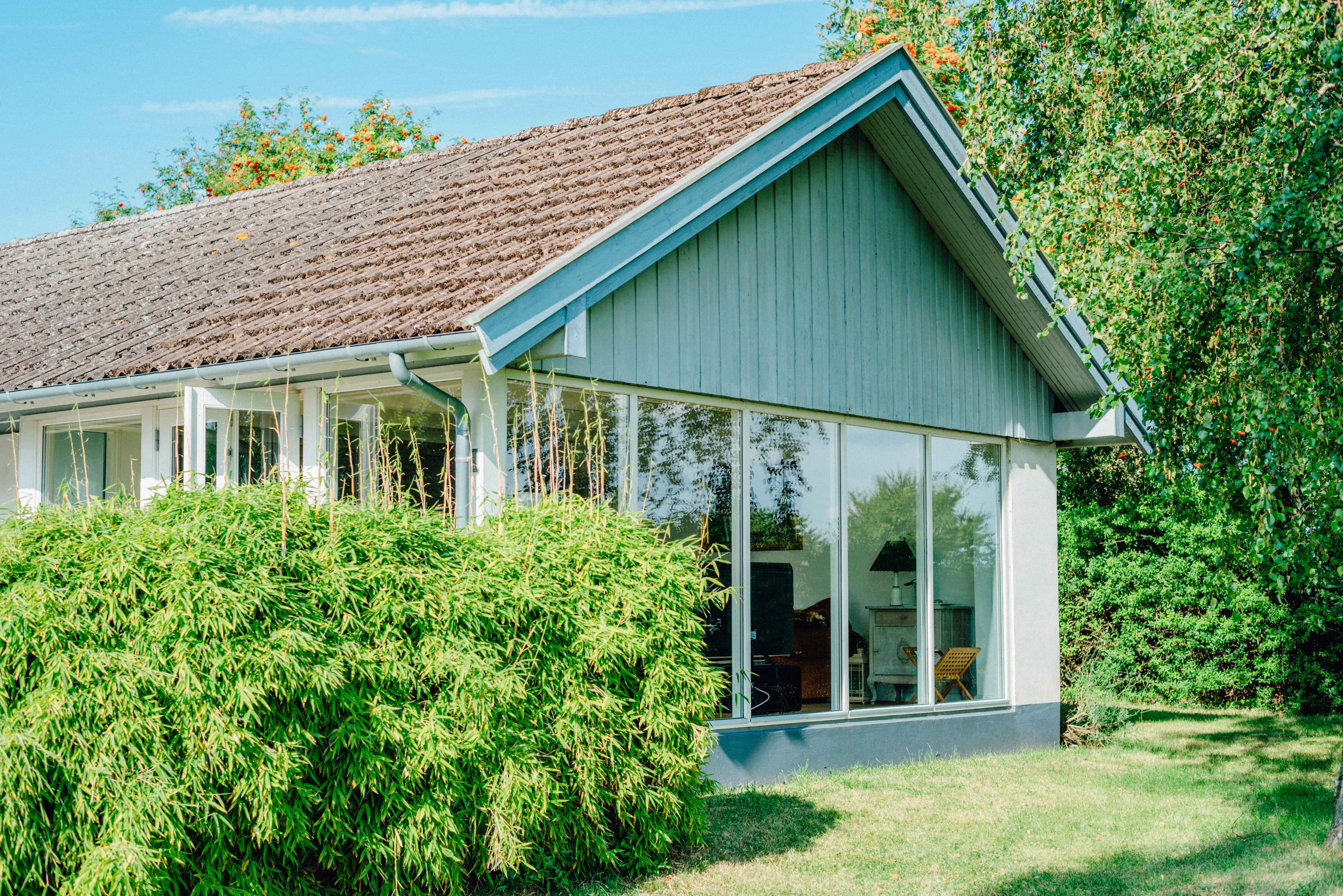 a rural home with new, modern windows - free window replacement program for seniors
