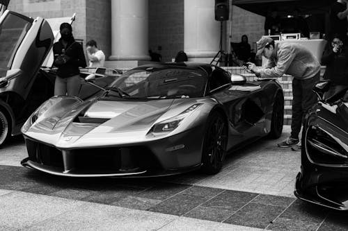 Grayscale Photo of a Sports Car