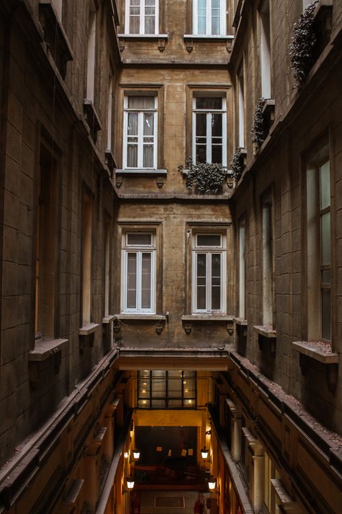 Free A vertical shot of a vintage building atrium showcasing elegant architectural details. Stock Photo