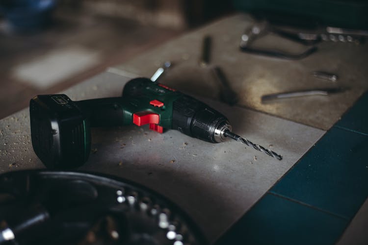 A Close-Up Shot Of A Cordless Drill