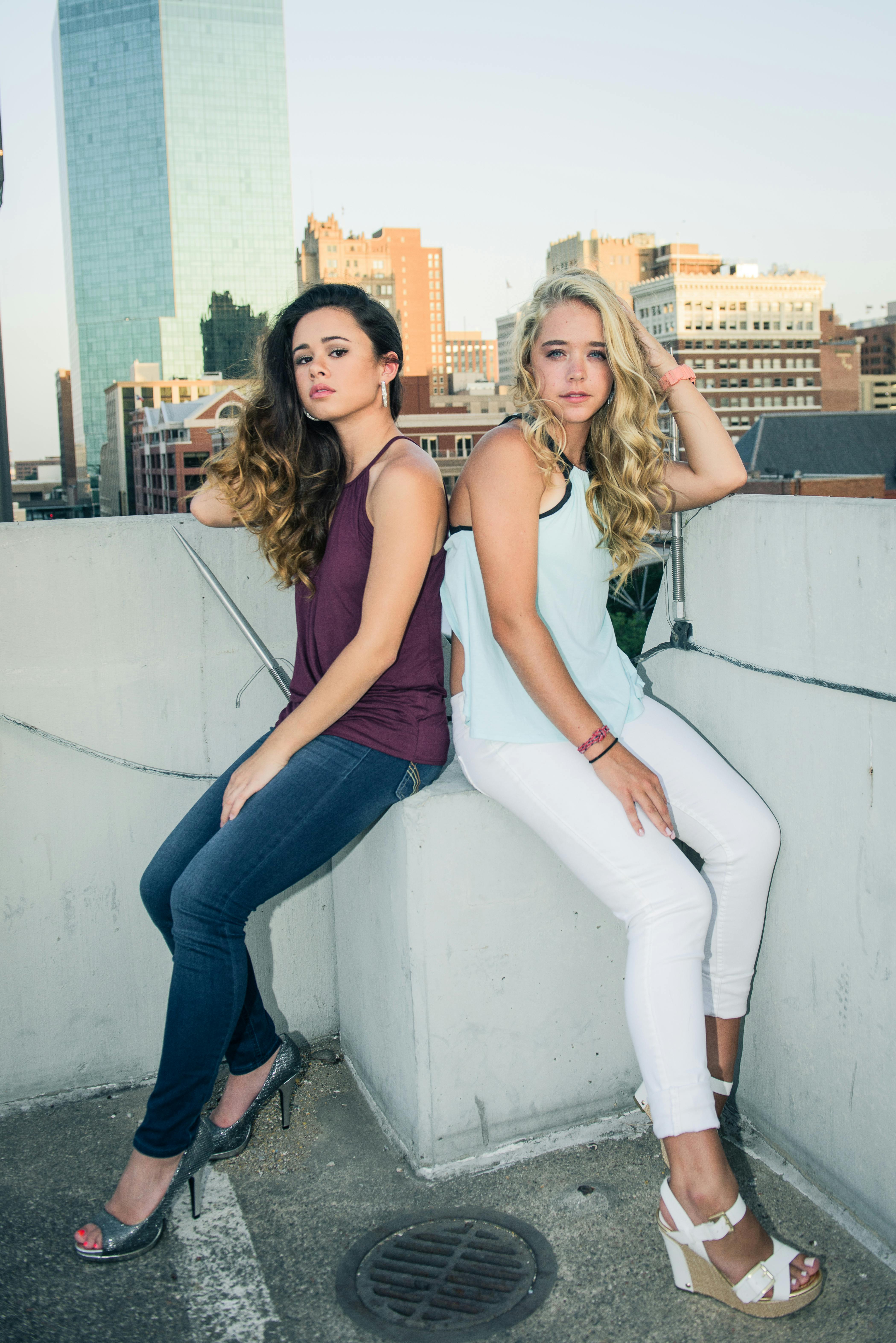 women sitting on the concrete platform