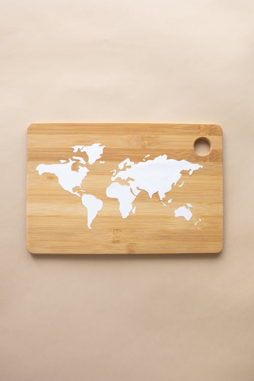 A World Map Paper Cutting on a Chopping Board