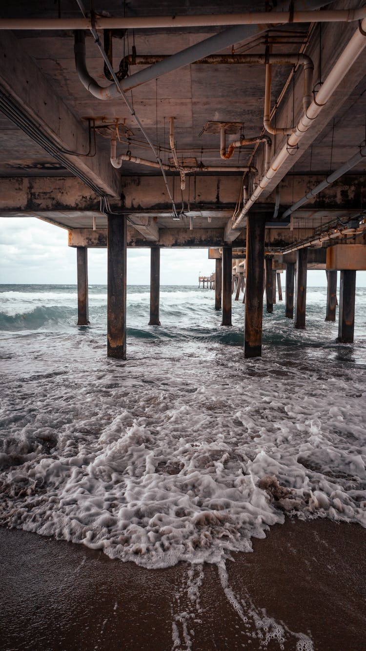 Crashing Waves Under The Dock