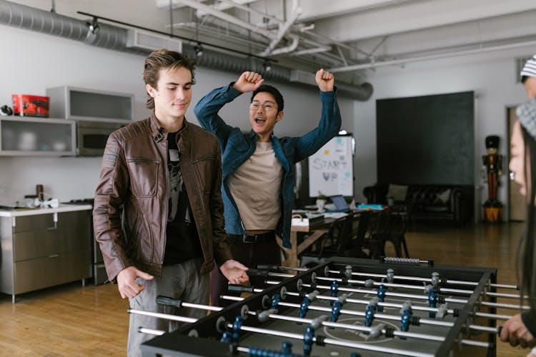 People Playing FoosBall