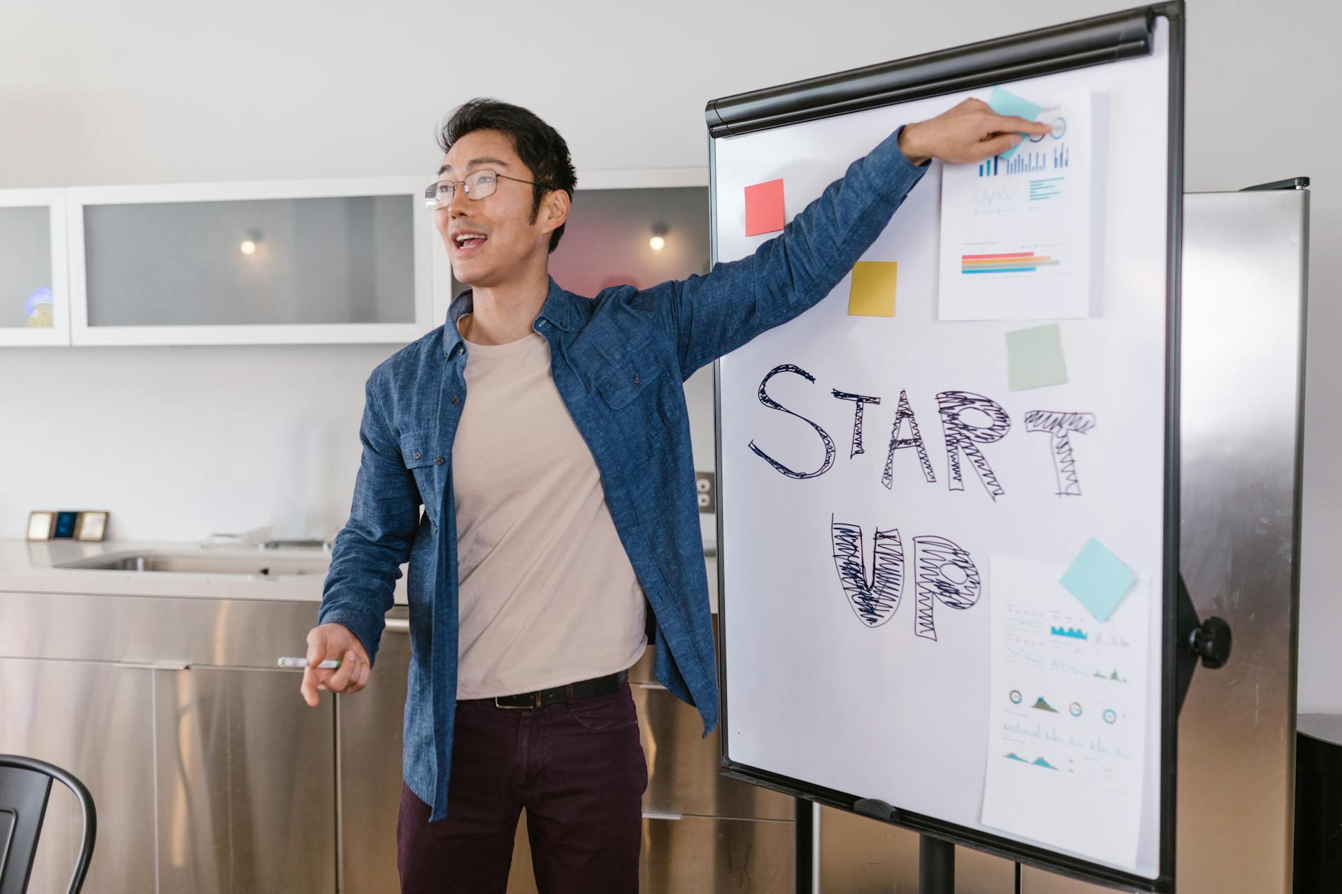 Entrepreneur presenting a startup plan at a meeting, engaging and dynamic business environment.