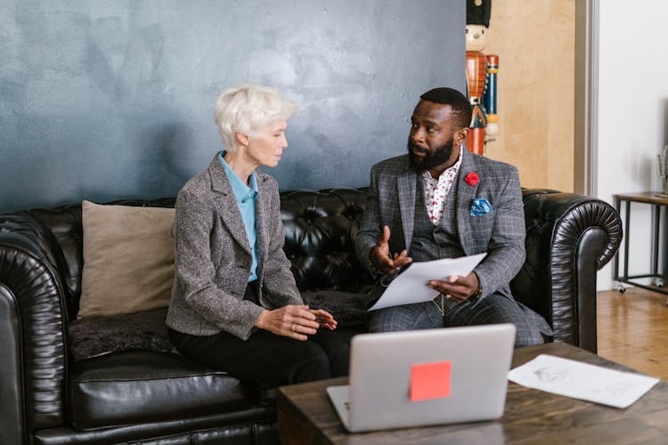 A Man And An Elderly Woman Having A Discussion