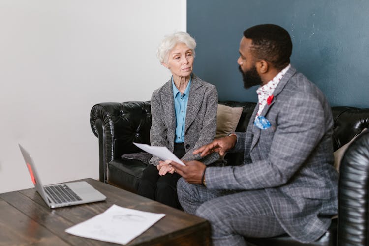 A Man And An Elderly Woman Having A Discussion