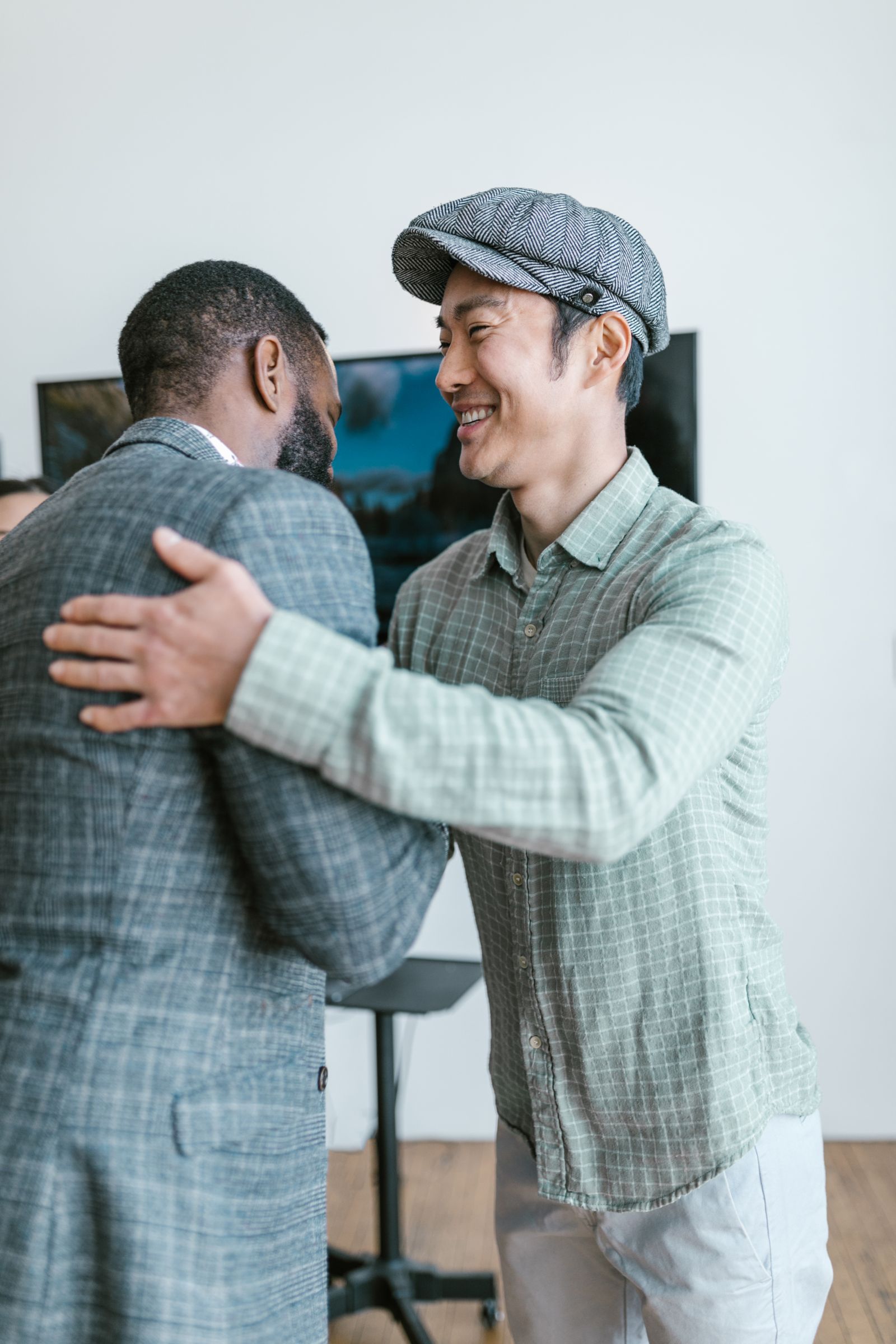 Two businessmen shaking hands in an office
