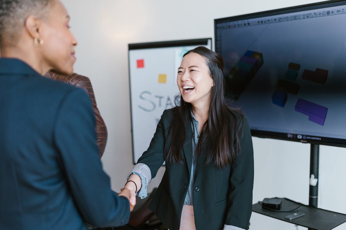 Free Woman in Black Blazer Smiling Stock Photo