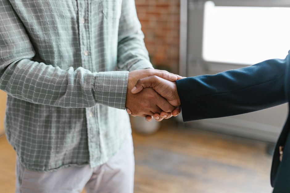 Business handshake between investor and entrepreneur