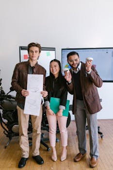 Three diverse entrepreneurs showcasing their startup ideas with creativity and collaboration indoors.