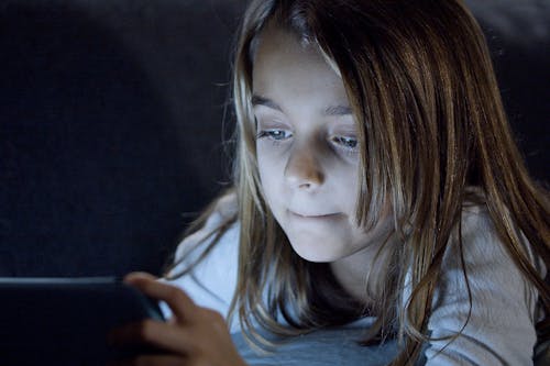 Free Young Girl Watching Video  Stock Photo