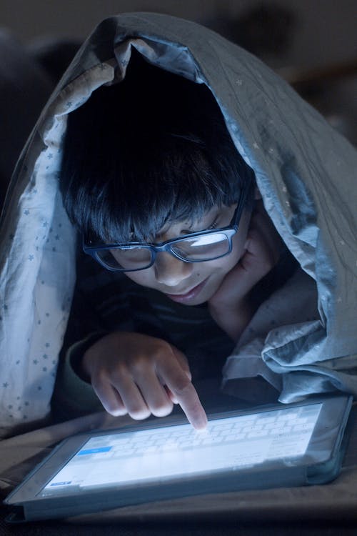 Free Boy in Black Framed Eyeglasses Using a Digital Tablet Stock Photo