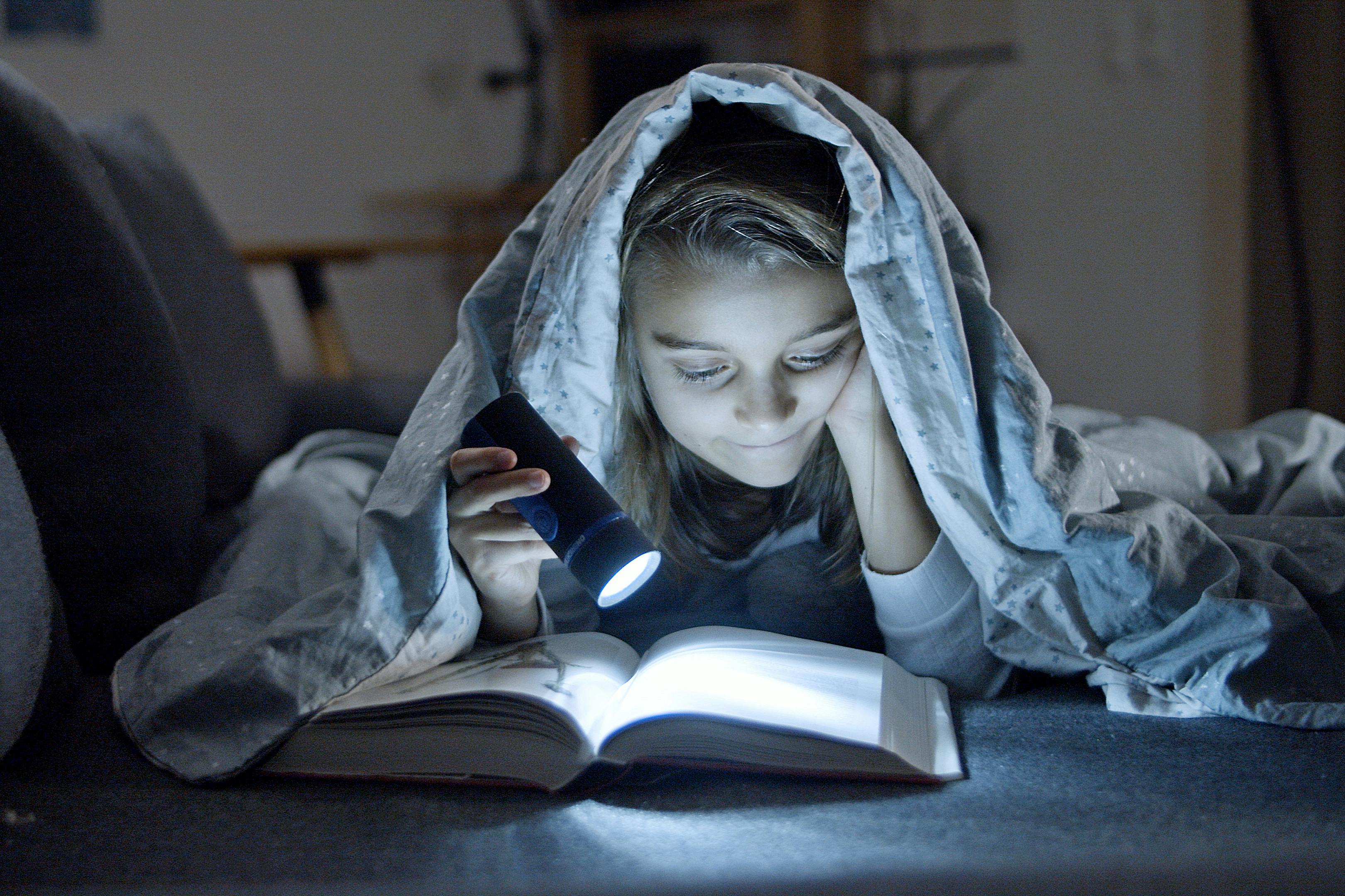 young girl reading a book