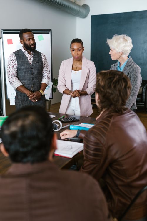 Engaged team discussing agency strategy in a modern office environment