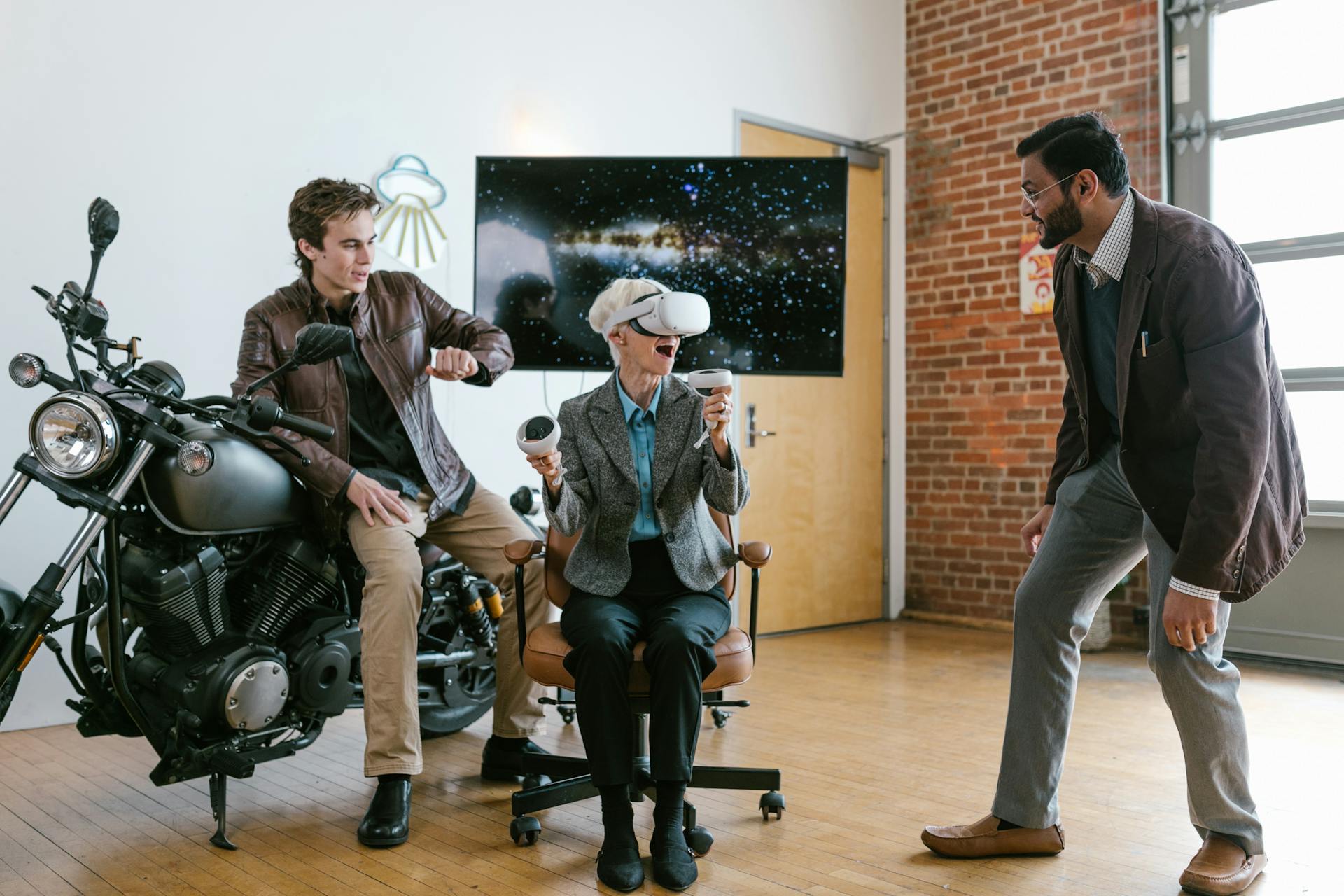 Three individuals enjoying a virtual reality experience in a modern indoor setting.