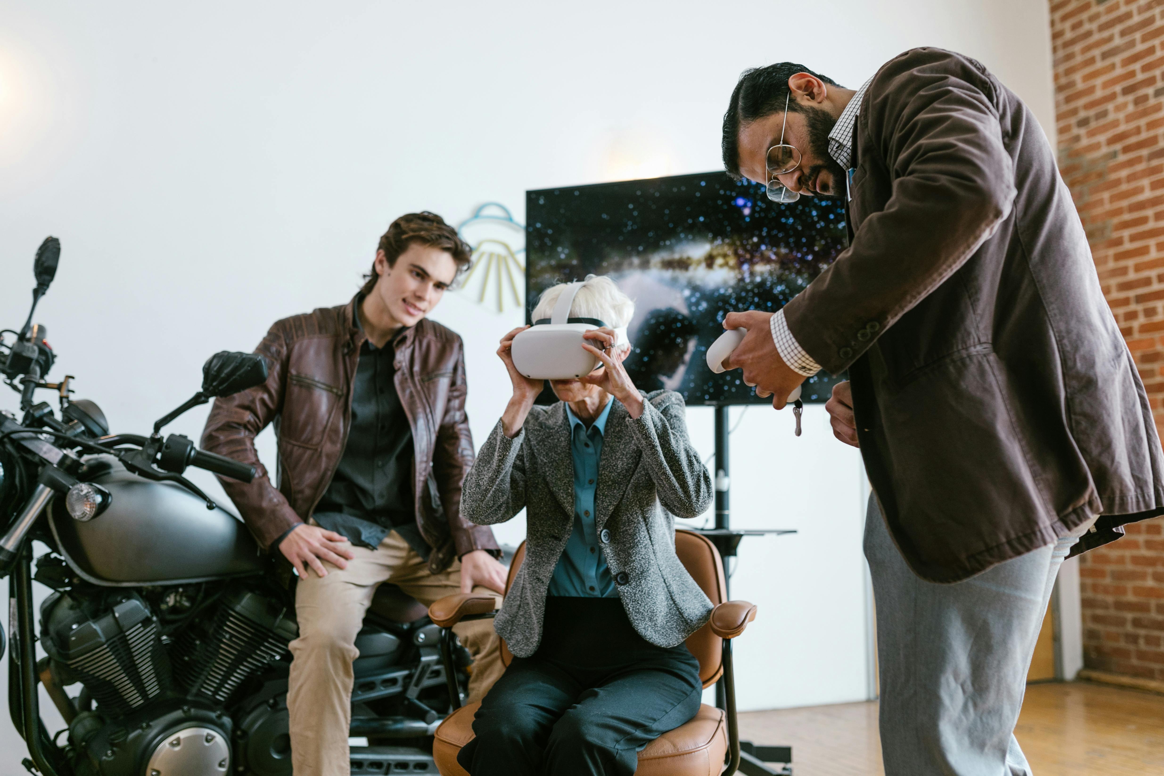 man in brown jacket sitting on black chair holding white ceramic mug