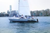 People Riding on White Sail Boat