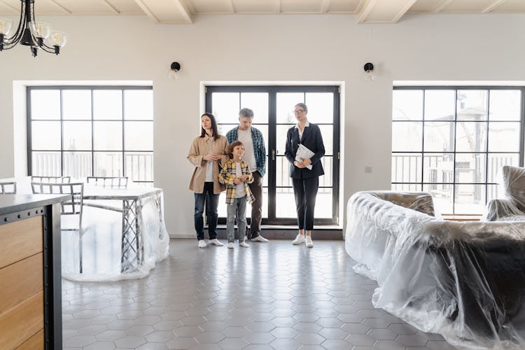 A Family Inside A House With New Furniture