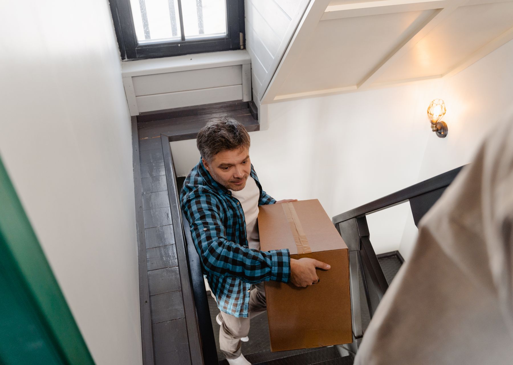 Furniture assembly anywhere in the UK — crew wrapping and loading on moving day