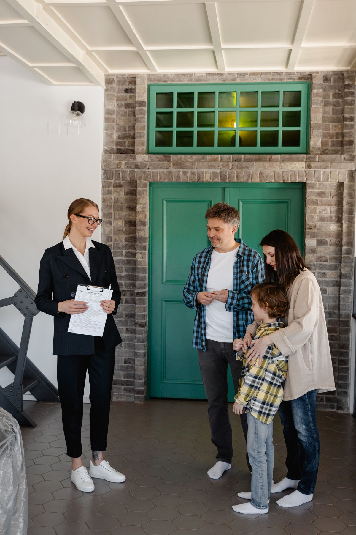 Buyer's agent showing a home to a family
