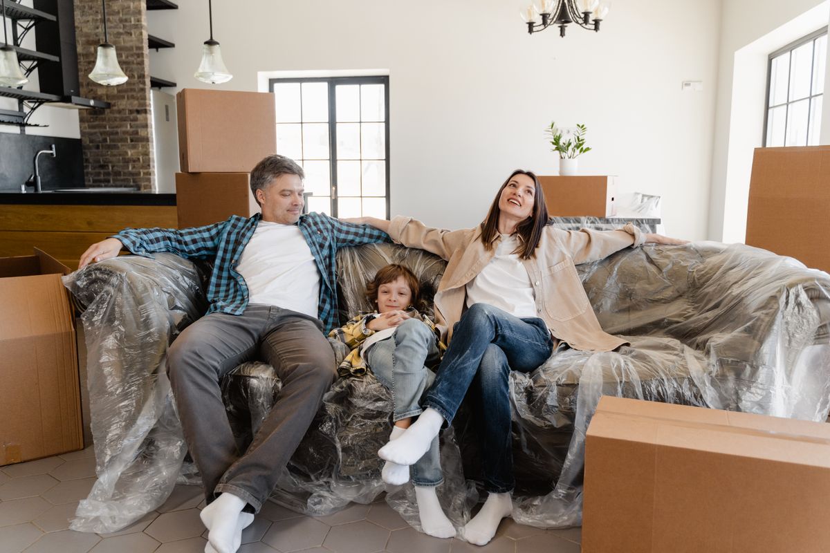 A family in their new home, protected by a policy their agent closed from a chatbot lead