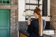 Back View of Woman Taking a Picture