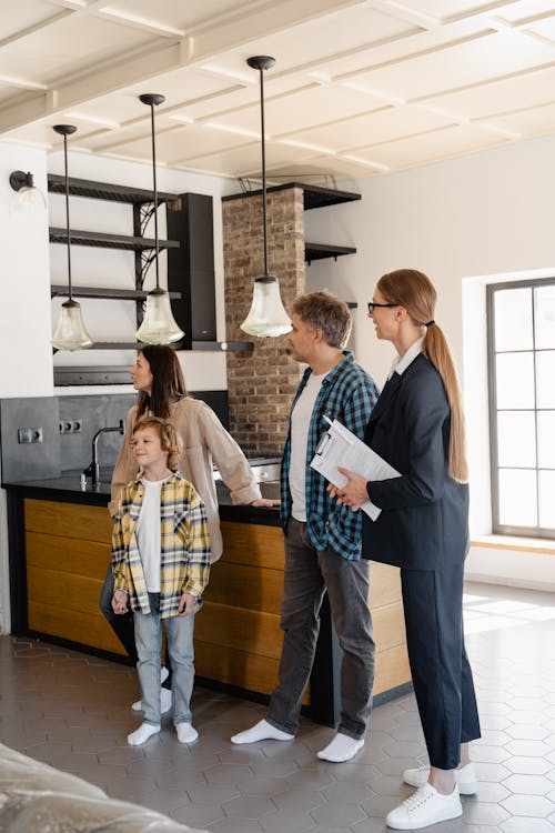 Free 
A Family with a Real Estate Agent Stock Photo
