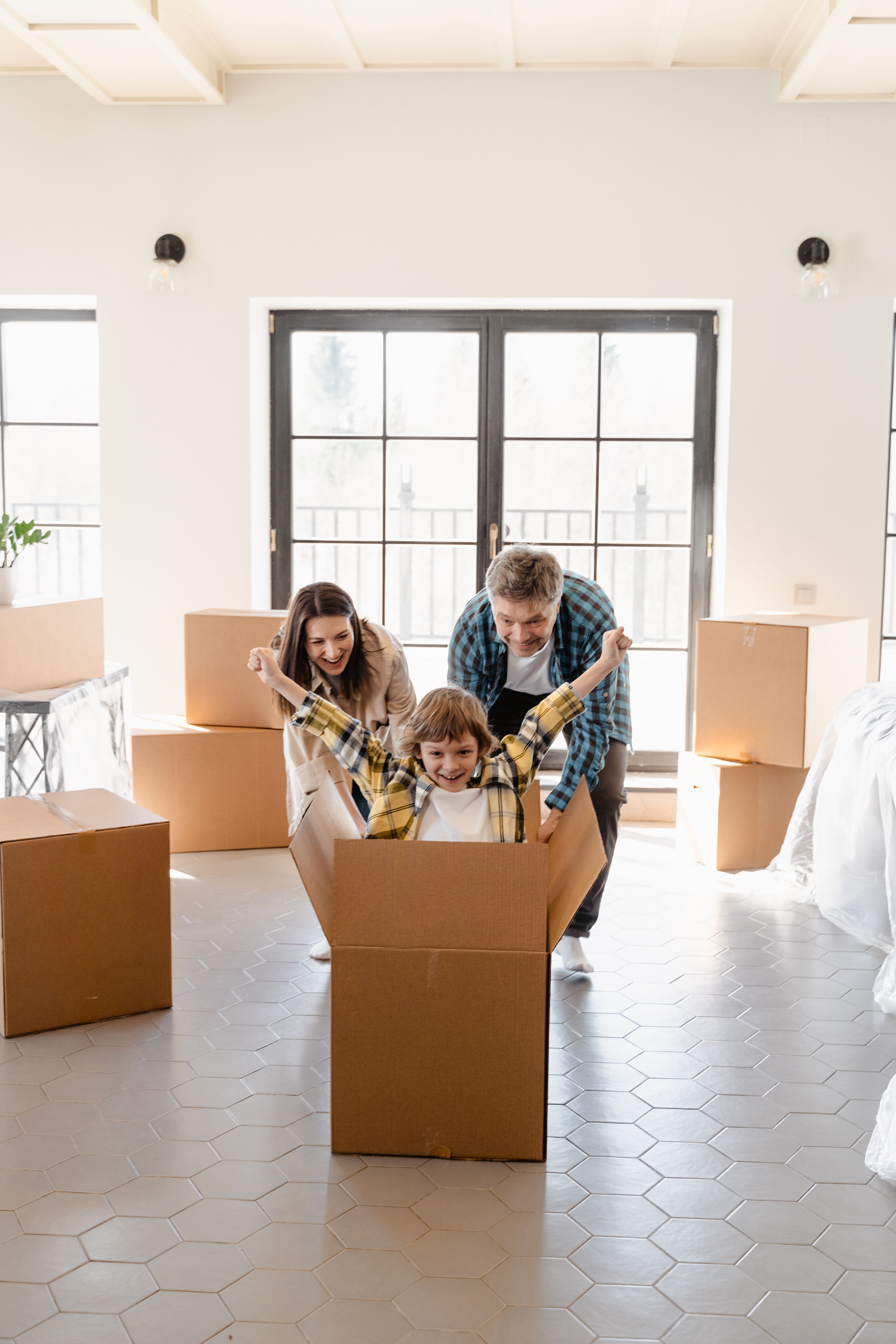 A family unpacking boxes in their new home.