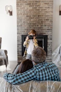 Family enjoying their new living room as a child takes a photo. A warm and cozy moment.