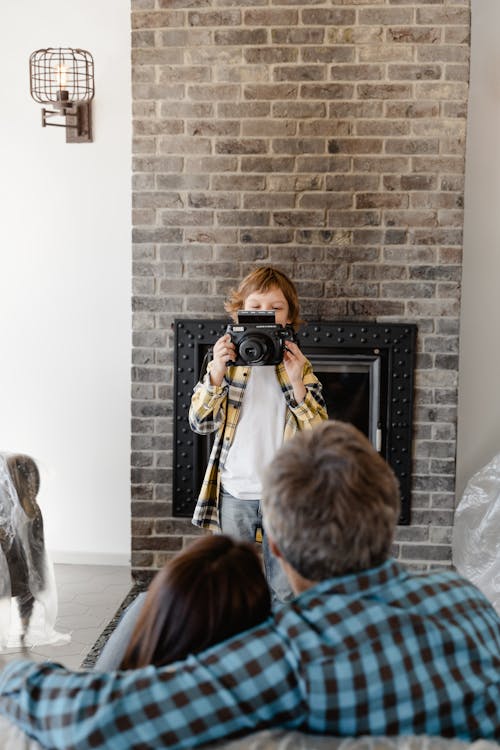 Child taking a Photo of his Parents 